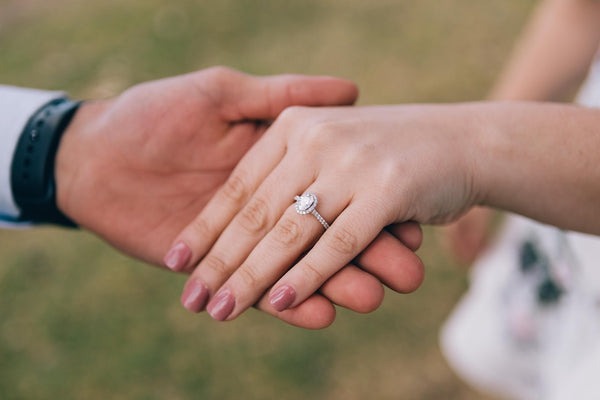 diamond ring in a hand